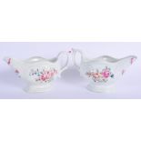 A PAIR OF 18TH CENTURY ENGLISH PORCELAIN SAUCE BOATS probably Worcester, painted with flowers on a r