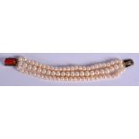 AN EDWARDIAN GOLD CORAL AND PEARL BRACELET. 45 grams. 18 cm long.