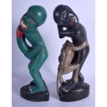 TWO UNUSUAL CONTINENTAL POLYCHROMED TRIBAL FERTILITY FIGURES modelled holding there genitals. 33 cm