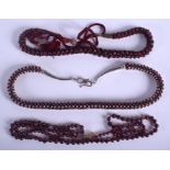 A LONG GARNET NECKLACE. 122 grams.