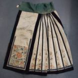 A LATE 19TH CENTURY CHINESE SILK EMBROIDERED SKIRT Late Qing, decorated with foliage and vines. 100