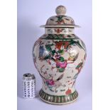 A LARGE 19TH CENTURY CHINESE FAMILLE VERTE VASE AND COVER of crackle glazed form. 45 cm x 21 cm.