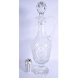 A VERY LARGE CRYSTAL CUT GLASS DECANTER AND STOPPER decorated with star shaped motifs. 57 cm x 20 cm