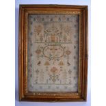 AN EARLY 19TH CENTURY ENGLISH EMBROIDERED SAMPLER by Sarah Bennett C1804, decorated with birds and f