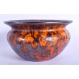 AN EARLY 19TH CENTURY SCOTTISH TREACLE GLAZED BOWL of tortoiseshell style glaze. 14 cm wide.