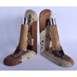 A PAIR OF EDWARDIAN GIRAFFE FOOT BOOKENDS with chrome mounts. 27 cm x 16 cm.