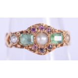 AN ANTIQUE 18CT GOLD EMERALD AND SEED PEARL RING. 1.8 grams. M.