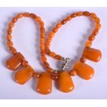 AN EARLY 20TH CENTURY CONTINENTAL AMBER NECKLACE. 14 grams. 34 cm long.