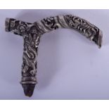 A 19TH CENTURY CHINESE SILVER DRAGON CANE HANDLE decorated with dragons in various pursuits. 115 gra