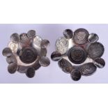 A PAIR OF CONTINENTAL SILVER COIN DISHES. 354 grams. 11 cm wide.