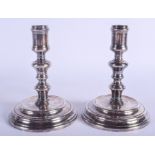 A STYLISH PAIR OF FRENCH CHRISTOFLE SILVER PLATED CANDLESTICKS. 18 cm high.