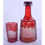 A 19TH CENTURY BOHEMIAN RUBY GLASS DECANTER AND STOPPER together with a matching glass. Largest 24 c