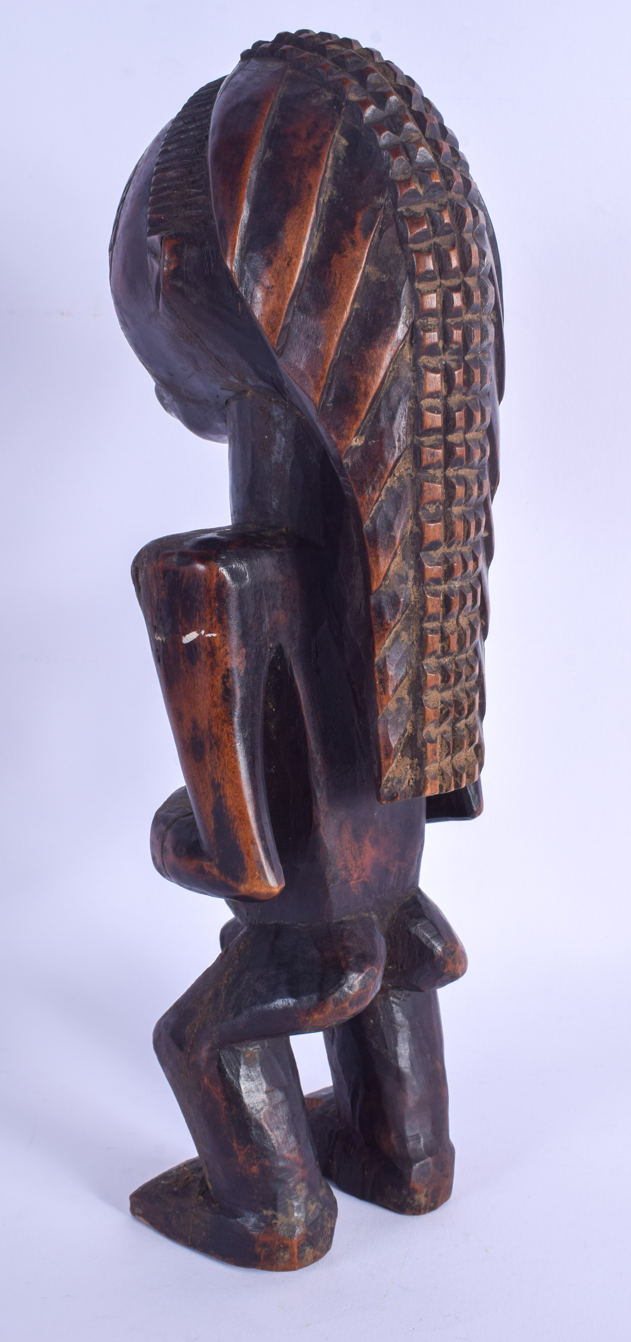 AN UNUSUAL AFRICAN TRIBAL CARVED WOOD LUBA FIGURE modelled with braided hair. 33 cm high. - Image 3 of 4