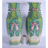 A LARGE PAIR OF CHINESE TWIN HANDLED FAMILLE ROSE PORCELAIN VASES 20th Century, painted with moths a