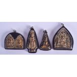 FOUR EARLY 20TH CENTURY SOUTH EAST ASIAN SILVER MOUNTED BUDDHISTIC ICONS. Largest 6 cm x 6 cm. (4)