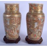 A PAIR OF 19TH CENTURY JAPANESE MEIJI PERIOD SATSUMA VASES painted with figures and landscapes. 30 c