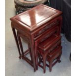 A NEST OF FOUR CHINESE RED WOOD TABLES 20th Century. Largest 66 cm x 50 cm. (4)