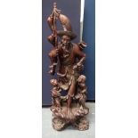 A VERY LARGE 19TH CENTURY CHINESE HARDWOOD FIGURE OF A FISHERMAN Qing, of monumental proportions. 86