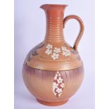 A 19TH CENTURY FRENCH SARREGUEMINES STONEWARE JUG decorated with floral sprays. 23.5 cm high.