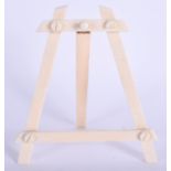 AN EDWARDIAN IVORY EASEL. 13 cm x 13 cm.