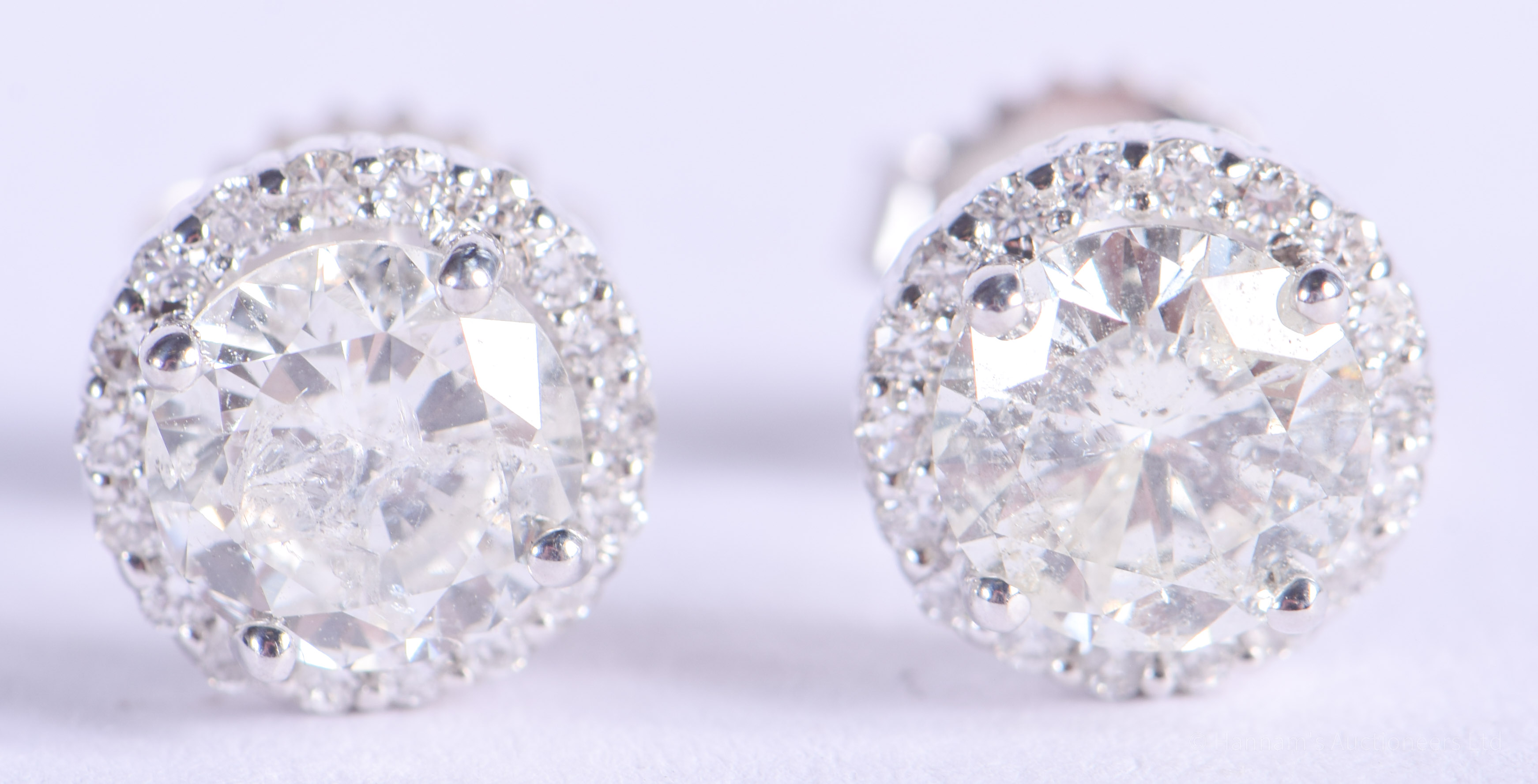 A PAIR OF 18CT WHITE GOLD AND DIAMOND EARRINGS of approx 2cts. 2.2 grams.