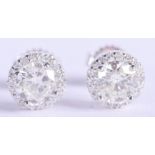A PAIR OF 18CT WHITE GOLD AND DIAMOND EARRINGS of approx 2cts. 2.2 grams.