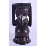 A SMALL AFRICAN TRIBAL LUBA CARYATID HEAD REST of figural form. 13 cm x 5 cm.