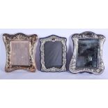 THREE LARGE SILVER PHOTOGRAPH FRAMES inc a London 1986 example. Largest 30 cm x 22 cm. (3)