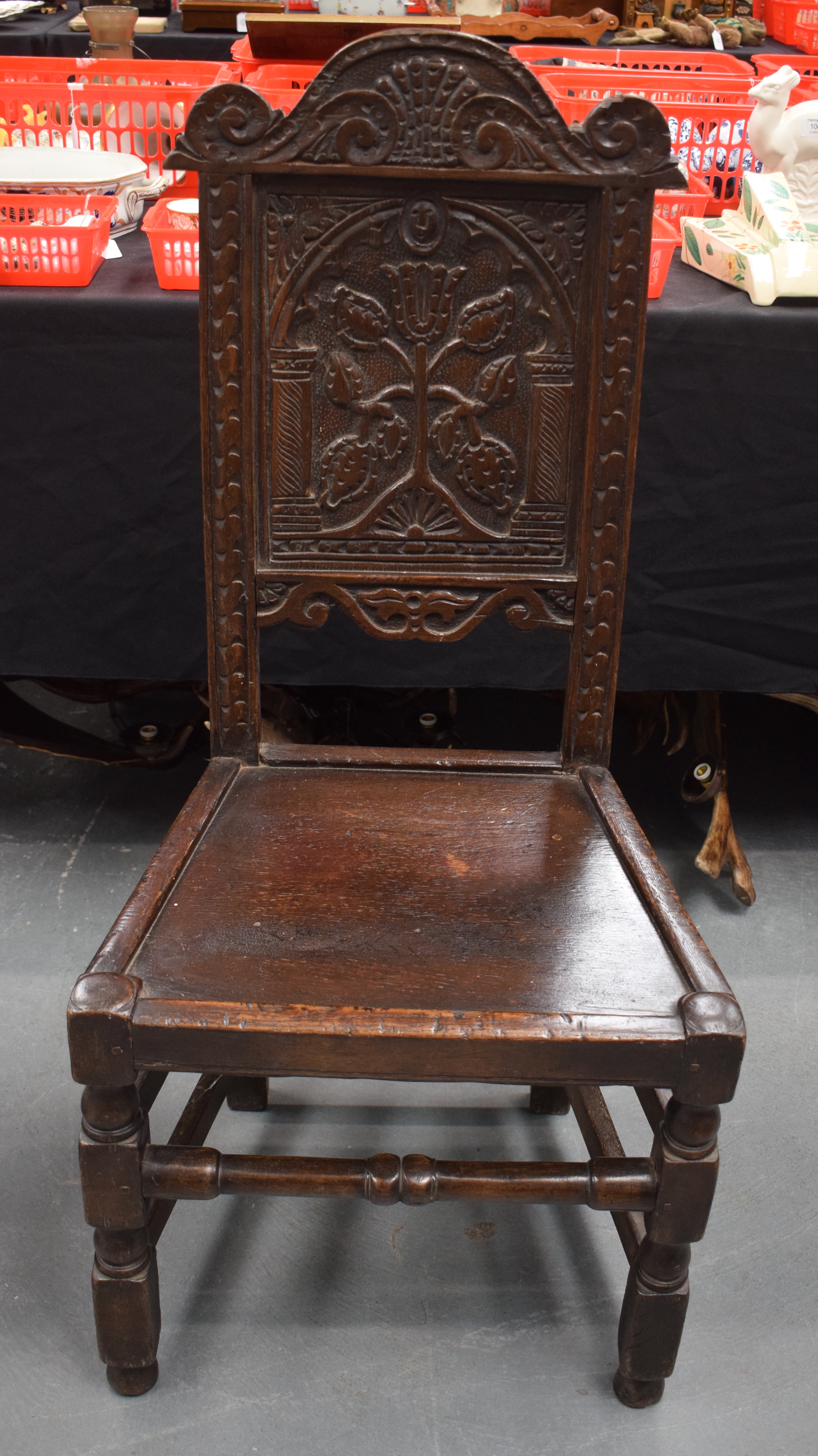 A 17TH CENTURY OAK DINING CHAIR with Tudor style floral back splat. 104 cm x 48 cm.