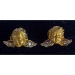 A PAIR OF 18CT GOLD AND DIAMOND CUPID EARRINGS. 3.8 grams. 1.4 cm x 0.8 cm.