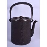 A 19TH CENTURY CAST IRON AND BRONZE TETSUBIN TEAPOT with peach finial. 25 cm high inc handle.