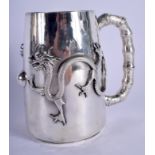 A VERY RARE 19TH CENTURY CHINESE EXPORT SILVER MUG decorated in relief with dragons pursuing a flami