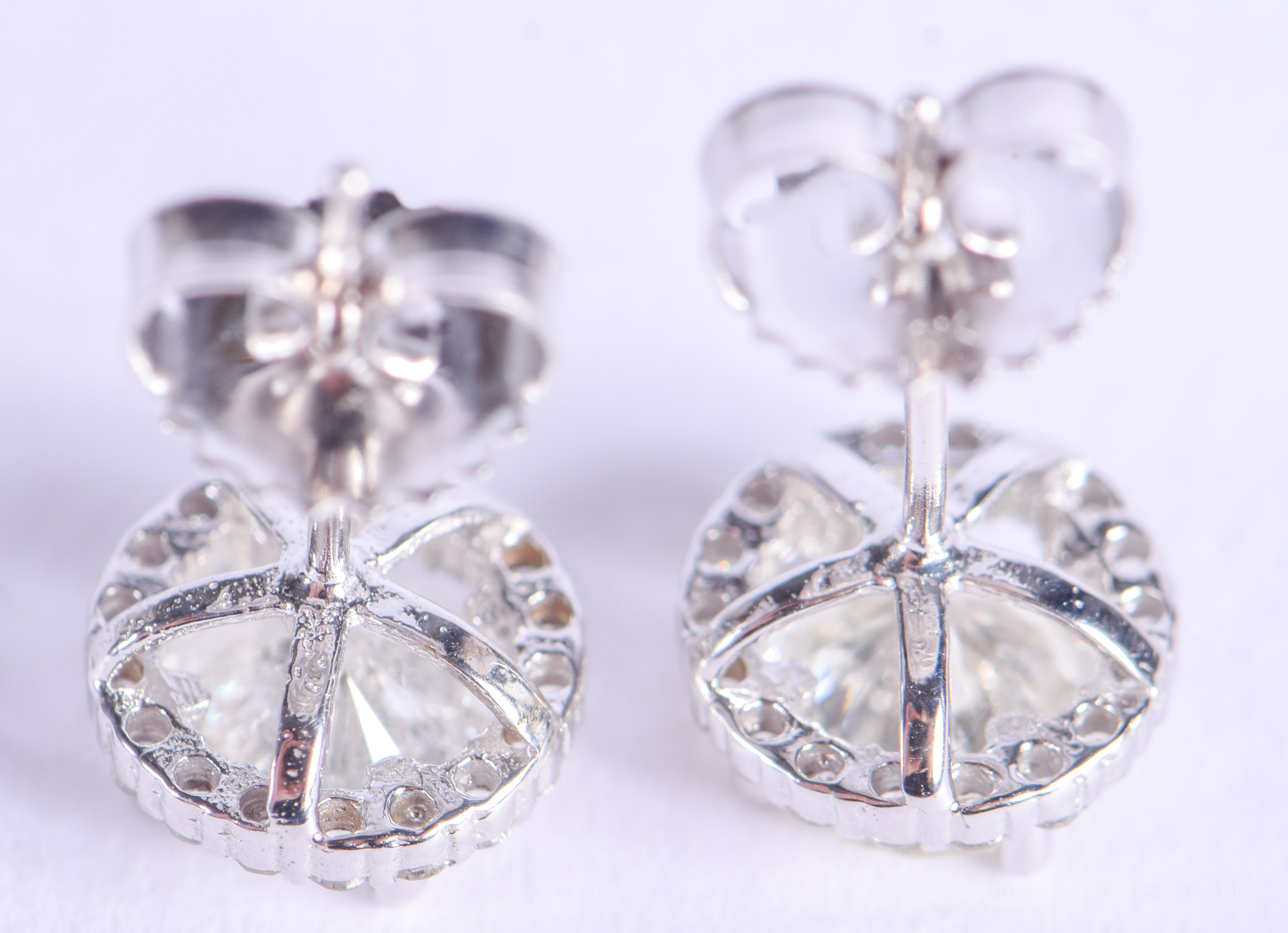 A PAIR OF 18CT WHITE GOLD AND DIAMOND EARRINGS of approx 2cts. 2.2 grams. - Image 2 of 2