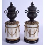 A RARE PAIR OF EARLY 19TH CENTURY FRENCH REVERSABLE CANDLESTICKS modelled upon marble plinths. 22 cm