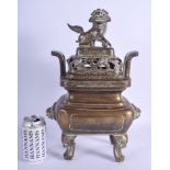 A 19TH CENTURY CHINESE TWIN HANDLED BRONZE CENSER AND COVER with Buddhistic lion terminal. 40 cm x 2