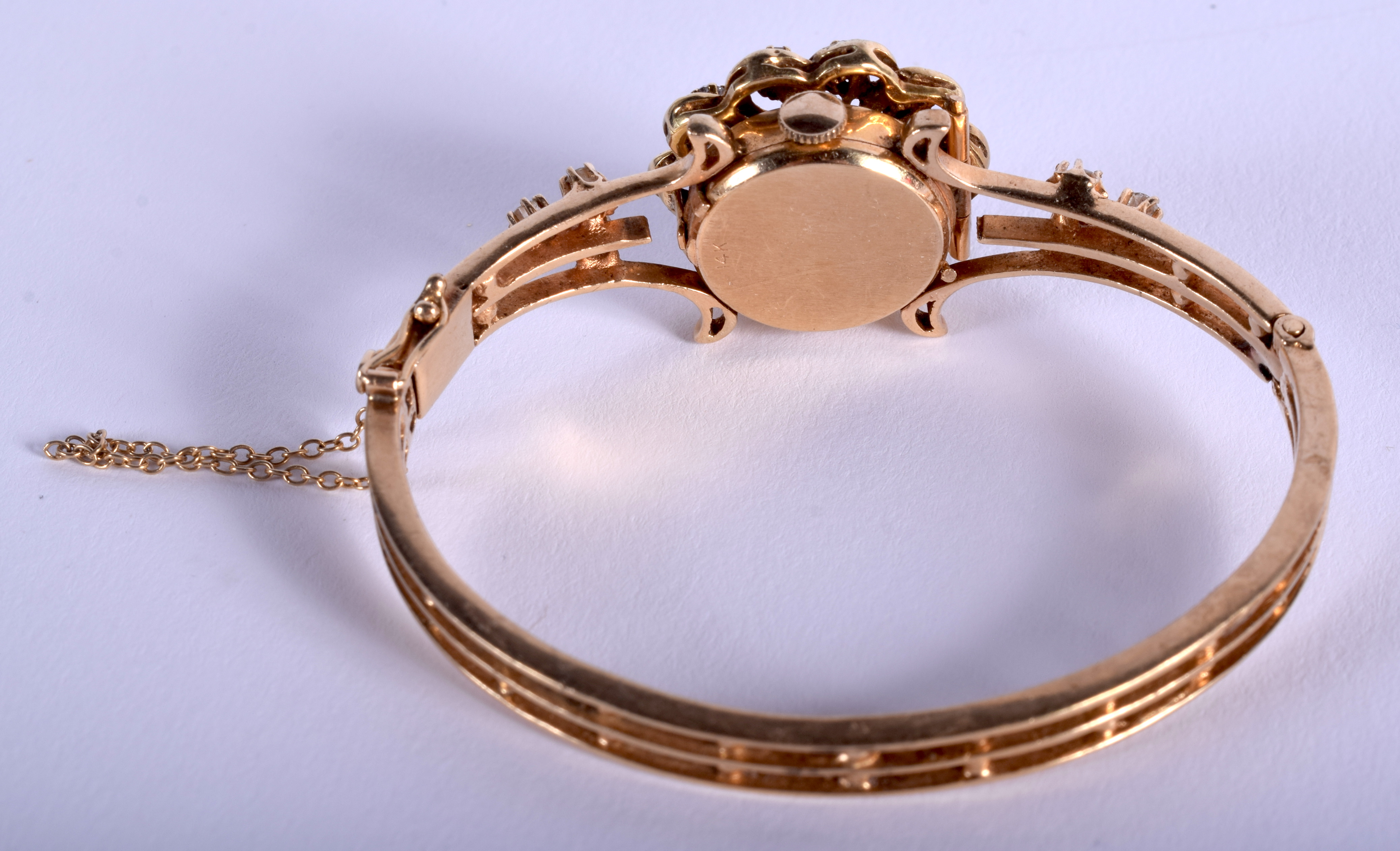 A GOOD 14CT GOLD LUCERNE BANGLE DIAMOND AND SAPPHIRE WRISTWATCH. 27.5 grams. 5.75 cm wide. - Image 2 of 5