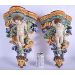 A LARGE PAIR OF 19TH CENTURY FRENCH FAIENCE GLAZED MAJOLICA BRACKET formed with putti amongst foliag