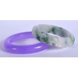 TWO CHINESE JADE BANGLES 20th Century. 9 cm diameter. (2)