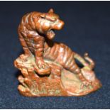 A small bronze Japanese tiger on a rock 6 cm