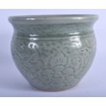 A 19TH CENTURY CHINESE CELADON POTTERY JARDINIERE decorated with foliage and vines. 13 cm x 16 cm.