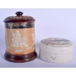 AN ANTIQUE SILVER MOUNTED DOULTON LAMBETH TOBACCO JAR AND COVER together with a paste pot. (2)