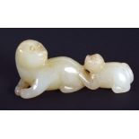 A CHINESE CARVED GREENISH WHITE JADE FIGURE 20th Century, modelled as two beasts. 6 cm wide.