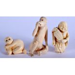 AN EARLY 20TH CENTURY JAPANESE MEIJI PERIOD CARVED IVORY NETSUKE together with two others. Largest