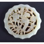 AN EARLY 20TH CENTURY CHINESE CARVED GREEN JADE OPENWORK PLAQUE Late Qing/Republic. 4.5 cm diameter