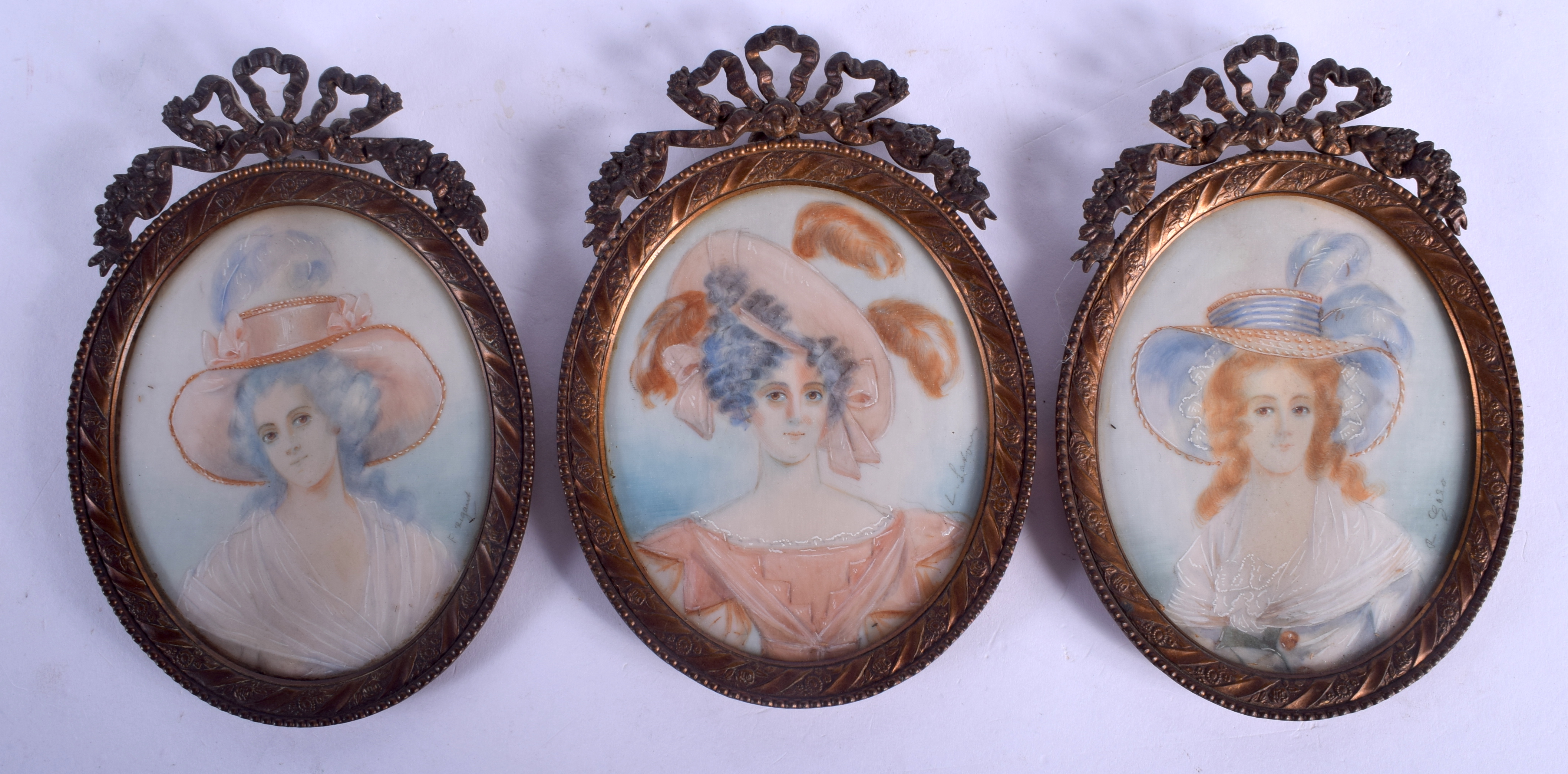 THREE EARLY 20TH CENTURY CONTINENTAL PAINTED IVORY PORTRAIT MINIATURES within gilt frames. Image 7.