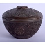 A CHINESE QING DYNASTY CARVED COCONUT BOX AND COVER decorated with motifs. 7.5 cm diameter.