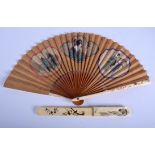 A 19TH CENTURY JAPANESE MEIJI PERIOD CARVED IVORY AND SILK FAN together with a similar Meiji paper