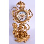 A 19TH CENTURY FRENCH GILT BRONZE SCROLLING MANTEL CLOCK painted with figures upon an enamelled dia