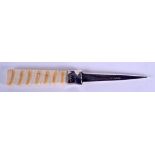 AN ANTIQUE SILVER MOUNTED MAMMOTH TOOTH LETTER OPENER. 21 cm long.