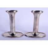 A PAIR OF SILVER CANDLESTICKS. 490 grams loaded. 13.5 cm high.